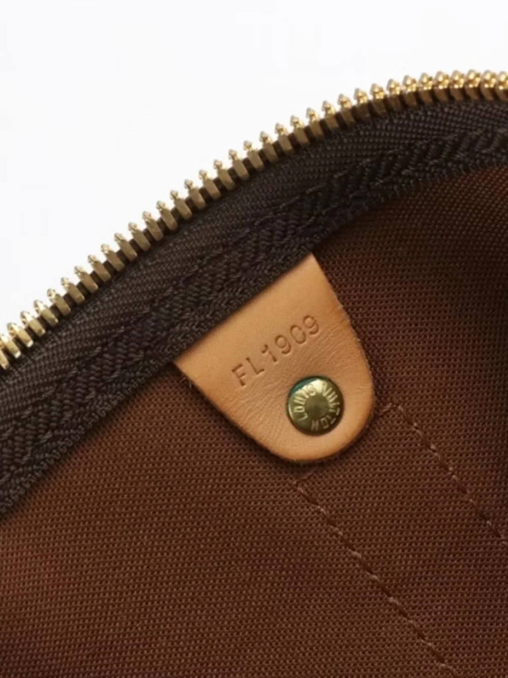 The Louis Vuitton Keepall Bandoulière 50 features iconic Monogram Canvas and Vac